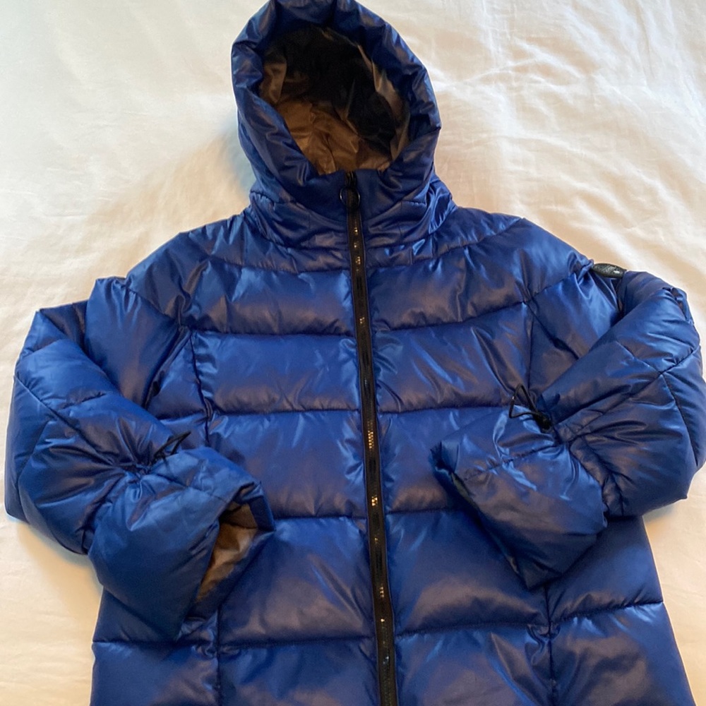 Noize puffer jacket with extended hood for extra wind coverage